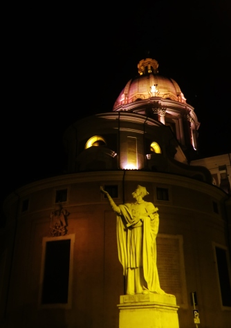 This statue was actually at a square. The angle takes in the statue, the circular building at the rear and the dome of a third building rearmost.